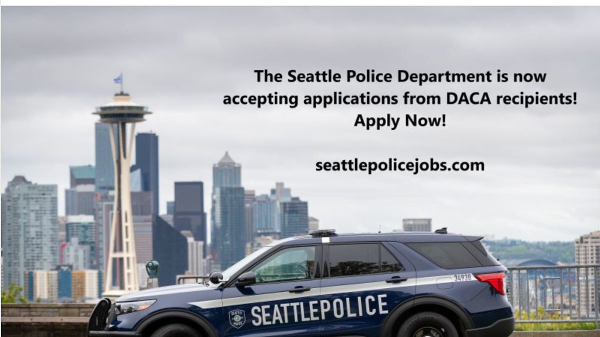 LinkedIn Seattle PD job posting. Police car in foreground, city skyline in background